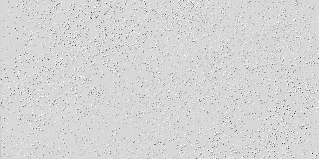 Nahaufnahme einer hellgrauen Raufasertapete mit vielen kleinen, erhabenen Kügelchen. Perfekt, um die Textur vor dem Streichen zu zeigen.